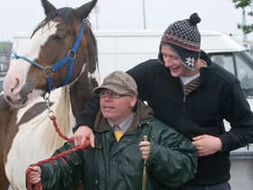 June 2012: Mark Wylie and Danny McCarron hold on tight during the historic Horse Fair in Derry. Picture Martin McKeown. Inpresspics.com. 16.6.12