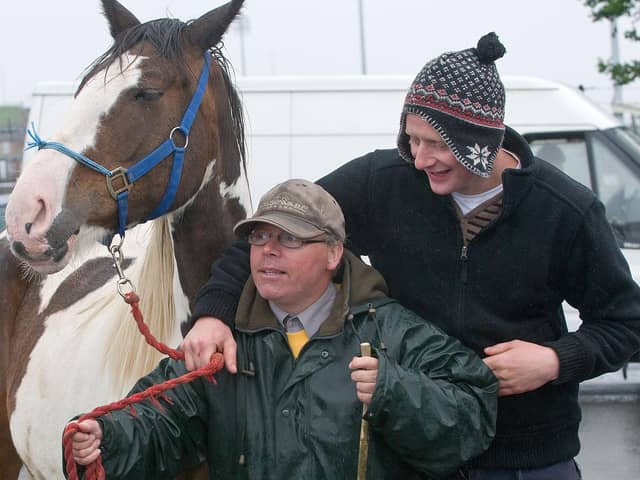 June 2012: Mark Wylie and Danny McCarron hold on tight during the historic Horse Fair in Derry. Picture Martin McKeown. Inpresspics.com. 16.6.12
