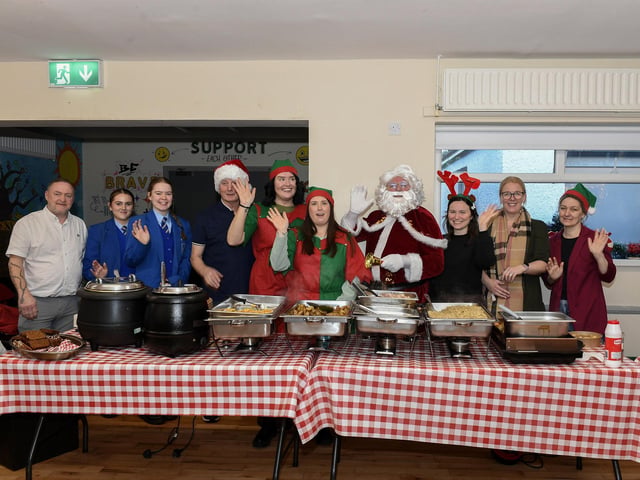 Santa pictured with staff and volunteers who helped prepare and serve the Ballymagroarty Hazelbank Community Partnership ‘Season of Thanks’ Christmas dinner held in the community centre. Photo: George Sweeney