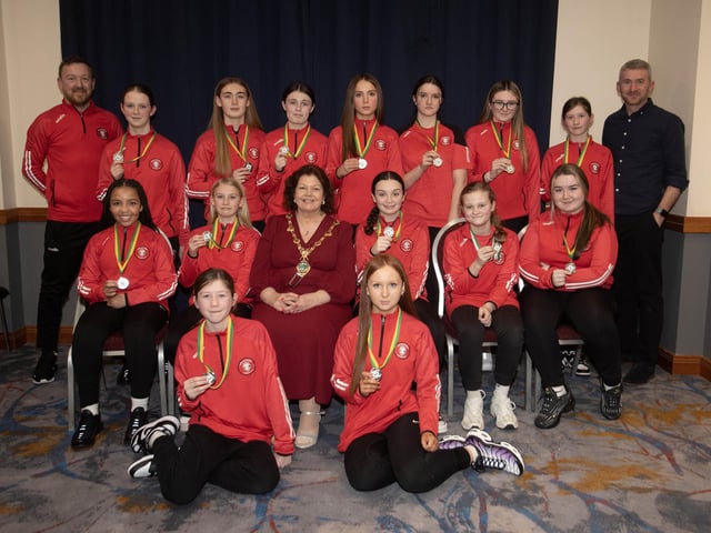 The Mayor of Derry City and Strabane District Council, Patricia Logue pictured with Tristar u-12s, runners-up in the Winter Cup. Included are coaches Gareth O'Donnell and Mark Crossan.