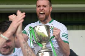 Craigbane captain Brian Rainey lifts the Derry Junior Championship trophy after their win over Ballerin in Celtic Park on Sunday afternoon last. Photo: George Sweeney.  DER2241GS