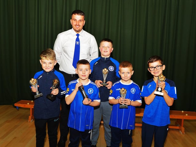 Vice-chairperson Diolain Ward pictured with 'Top Goalscorer' award winners at the Trojans FC annual Youth Presentation held in St Cecilia’s College. Photo: George Sweeney