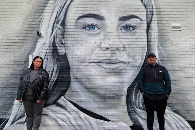 Caitlin McLaughlin's father Seamus Mahon and her sister Courtney at a new mural in her memory at Brookdale Park.