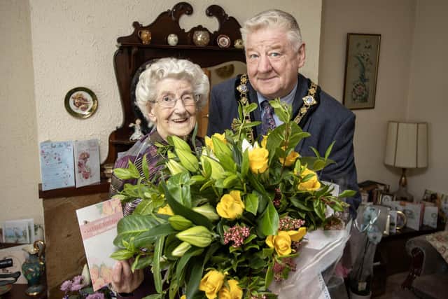 Mayor of Causeway Coast and Glens, Councillor Steven Callaghan joins Dorothy Cunningham to celebrate her 102nd birthday.