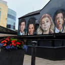 The Derry Girls Mural, on Orchard Street, with previously added pub awning.  Photo: George Sweeney