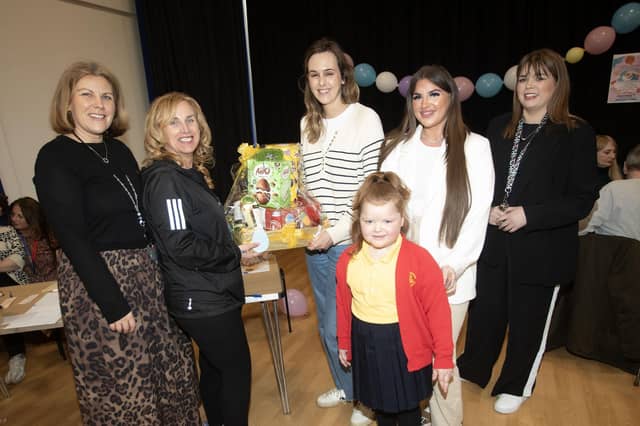 Mrs. Bernie Fox presents the prize draw to Mrs O ’Hea during last Friday morning's Steelstown Primary School's Angel Wishes Charity Coffee Morning at the school. (Photos: Jim McCafferty Photography)