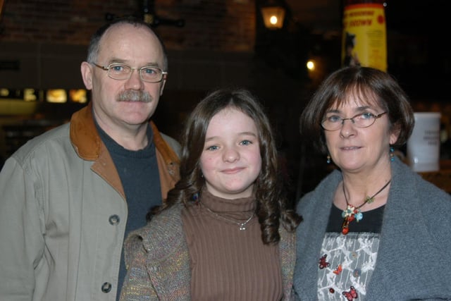 Anna celebrating her birthday with family and friends at the bowling alley.