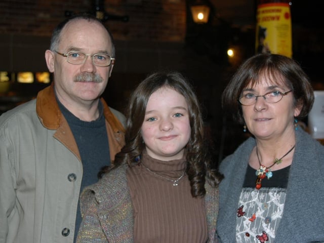 Anna celebrating her birthday with family and friends at the bowling alley.