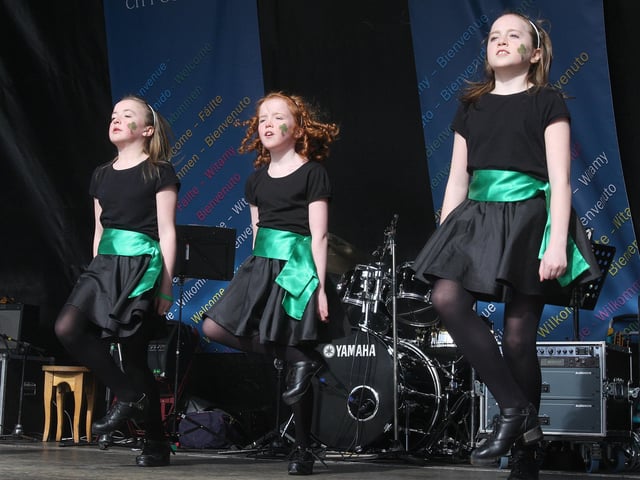 Local Irish dancers entertain the crowd on stage in Derry for St. Patrick’s Day.