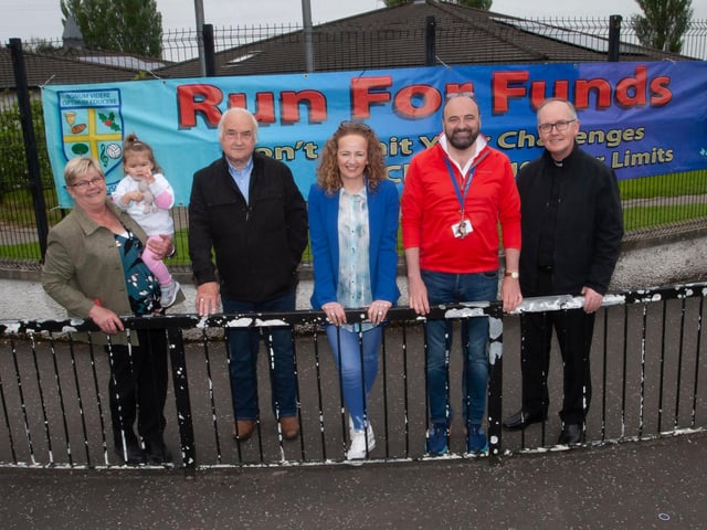 Acting Principal Mr. Feargal Friel pictured with members of the Board of Governors at Hollybush on Friday as they await the runners.