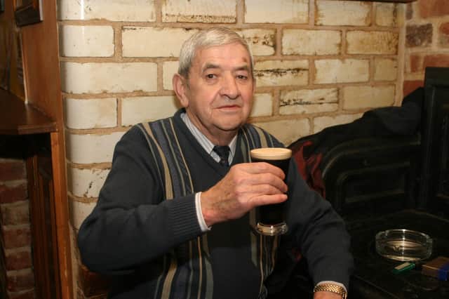 Brian 'Barney' O'Reilly enjoying a half pint of stout in his favourite corner in The Don Bar on a Sunday evening in January 2004.