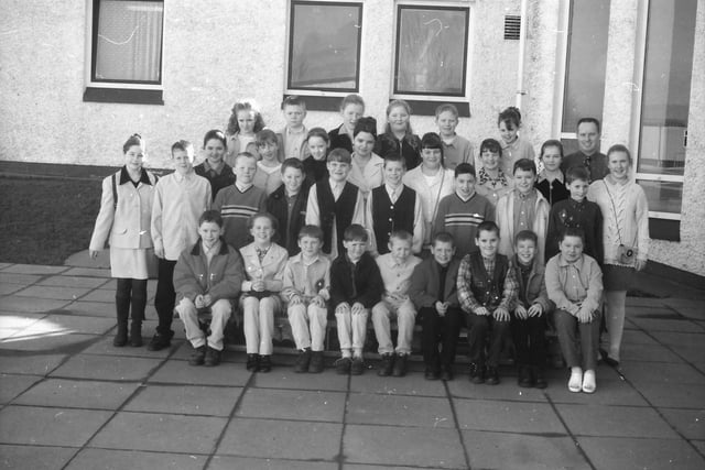 Pupils from Lenamore Primary School who were confirmed by Most Rev. Francis Lagan, Auxiliary Bishop of Derry, at St. Joseph's Church, Galliagh. Included is Mr. Barry McCafferty, class teacher.