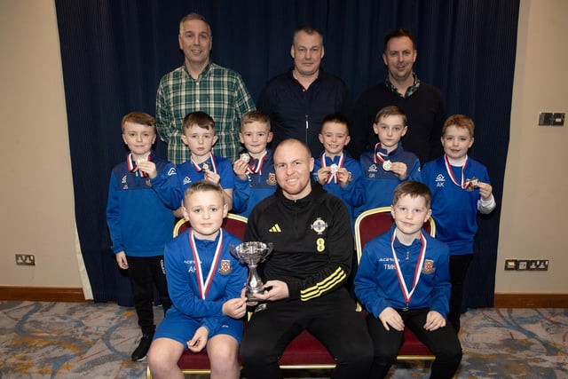 Ronan O'Donnell, Irish Football Association, special guest at the D&D Youth FA Annual Awards at the City Hotel on Friday night presents Limavady Youths U8s with the Premier Summer Cup. Included are coaches Jonathan Cassidy, Albert Rosborough and Trevor Starrett. (Photos: Jim McCafferty Photography)