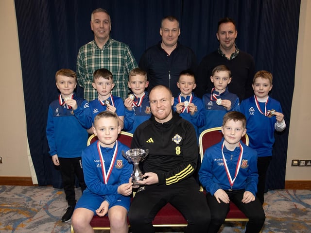 Ronan O'Donnell, Irish Football Association, special guest at the D&D Youth FA Annual Awards at the City Hotel on Friday night presents Limavady Youths U8s with the Premier Summer Cup. Included are coaches Jonathan Cassidy, Albert Rosborough and Trevor Starrett. (Photos: Jim McCafferty Photography)