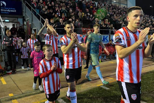 Derry City players make their way onto the pitch for the game against Drogheda United. Photograph: George Sweeney