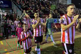Derry City players make their way onto the pitch for the game against Drogheda United. Photograph: George Sweeney