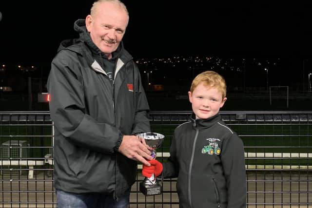 Enda O’Goan (right) presenting 'The Bashful Kennels Trophy' to Oliver Canavan after 'Olwinn Cara' was voted our favourite performer at last week's race meeting (Oct 10th)