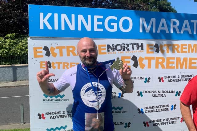 Terry at the finish line of the Kinnego Marathon, one of four marathons in four days in the Extreme North Quadrathon around Inishowen.