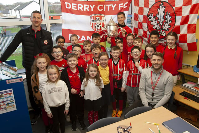Mr. Lowry and his P5 class welcome Patrick and Shane McEleney and the FAI Cup to Steelstown Primary School.