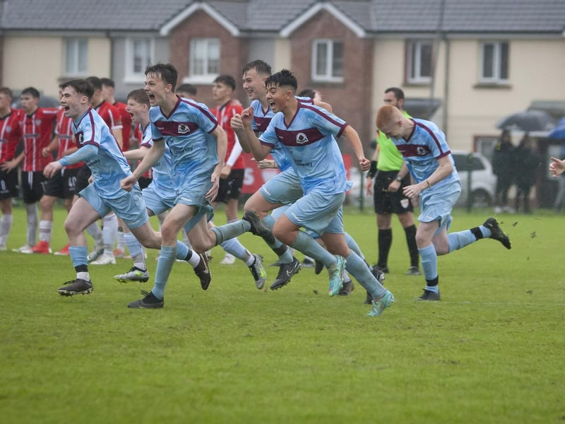 Institute players rush to celebrate their penalties victory over Derry City in the u-17 Foyle Cup on Friday night at Oakland Park, Derry.