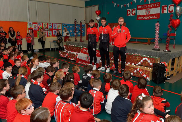 Pupils from Good Shepherd Primary School gave a rapturous welcome to Derry City players Mark Connolly, Liam Mullan and Jack Lemoignan during a visit to the school, with the FAI Cup, on Friday afternoon. Photo: George Sweeney. DER2247GS – 75