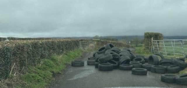 The Alder road was blocked after these tyres were illegally dumped.