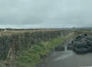 The Alder road was blocked after these tyres were illegally dumped.