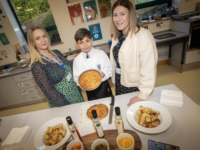 Hard at work on the HE Department during Open Day on Saturday are Amir Azizi with teachers Mrs. McQuillan and Mrs. Doherty.