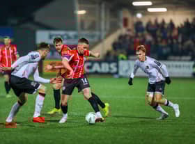 Derry City's Ben Doherty moves away from Dundalk right back Archie Davies. Photo by Kevin Moore.