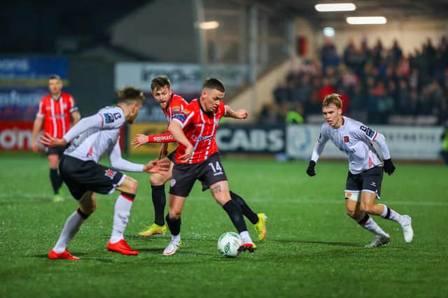 Derry City's Ben Doherty moves away from Dundalk right back Archie Davies. Photo by Kevin Moore.