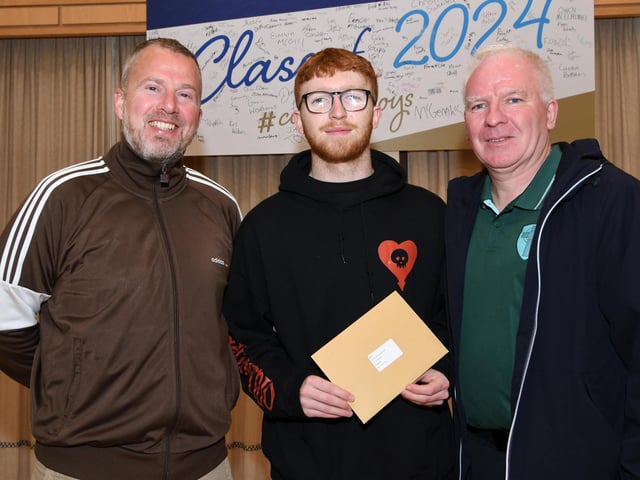 Damian McGuinness pictured with his proud dad Jim, right, and Michael McLaughlin, Head of Year 13, when he collected his results at St. Columb's College on Thursday morning.