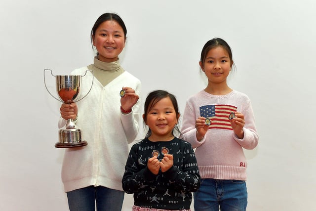 Maple Kong (left) and her sisters Michelle and Erin were placed first, in their age groups for Piano at the Feis Dhoire Cholmcille on Friday at the Millennium Forum. Photo: George Sweeney.  DER2315GS – 202 