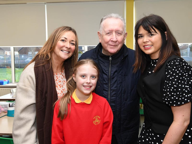 Primary 7 pupil Grace pictured with granda Charlie and her aunt. On right is Mrs. Catherine Doorish, Principal.