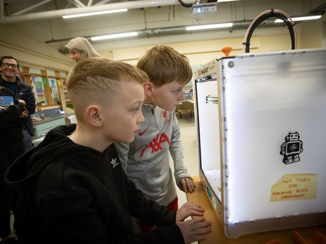 Hollybush PS. pupils Oisin and Zachary get to grips with 3D printing at St. Columb's on Saturday. (Photos: Jim McCafferty Photography) : .