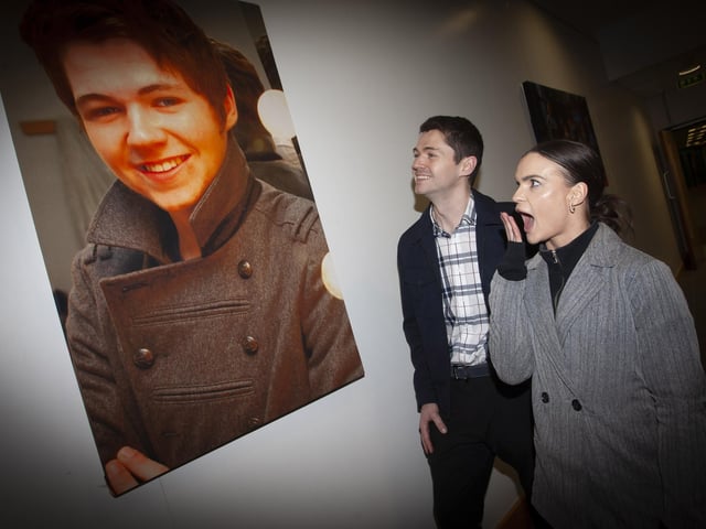 IS THAT REALLY YOU?! . . . . .Kaylee and Damian stop to check out of an 18 years-old Damian during his days at the North West Regional College, during Tuesday’s visit.