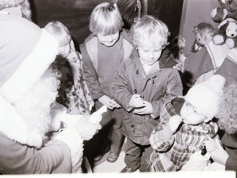 Children meeting Santa Claus at Wellworths shop in Waterloo Place.