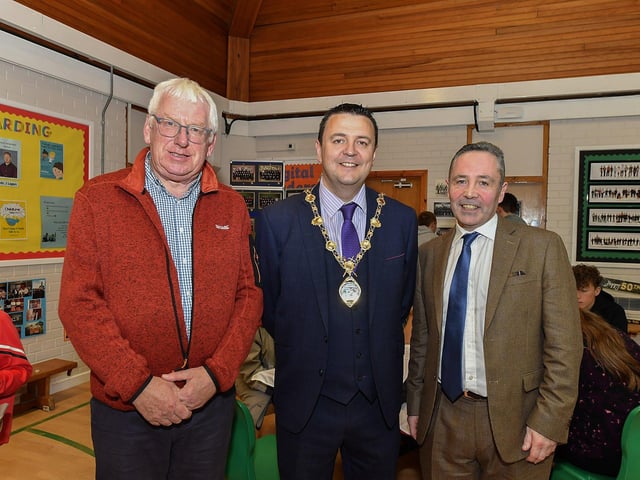 Former principal Brian McLaughlin (left) and current principal Eamonn Moore pictured with Mayor Ruairí McHugh at St Oliver Plunkett’s Primary School’s 50th anniversary celebrations on Thursday evening.