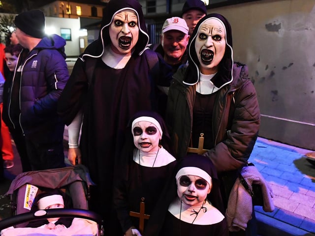 Spectators pictured at the Halloween parade.  Photo: George Sweeney