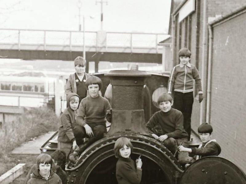 Newbuildings Cub Scouts lending a hand to clean up the train at Foyle Valley Railway Station.