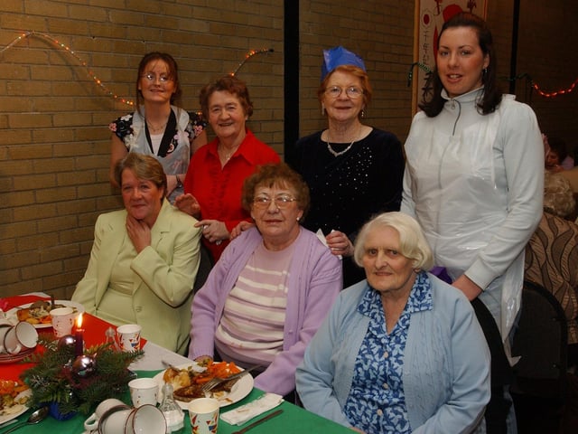 Seatedfrom left, Evelyn Gorman, Isobel Ramsey, and Jean McQuaice. Standing, from left, Karla McLaughlin, Jenny Conway, Susan Harris, and Emma McMenamin. (0912PG26) :Christmas parties for Derry's senior citizens in December 2003