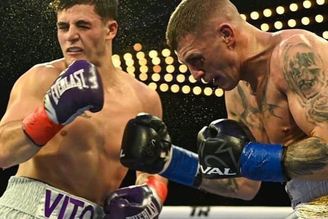 Connor Coyle [right] delivers a right hook to the head of Vito Mielnicki.