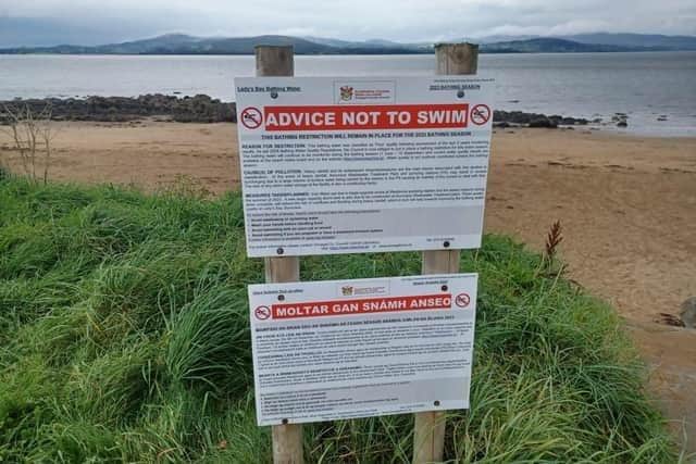 A notice advising people not to swim at Lady's Bay last year.