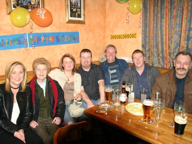 Raymond seated centre with a group of friends left to right Caroline, Mary, Claire, Raymond, Jimmy, Romano and Vaughan. 1193/dd : Parties in December 2005.