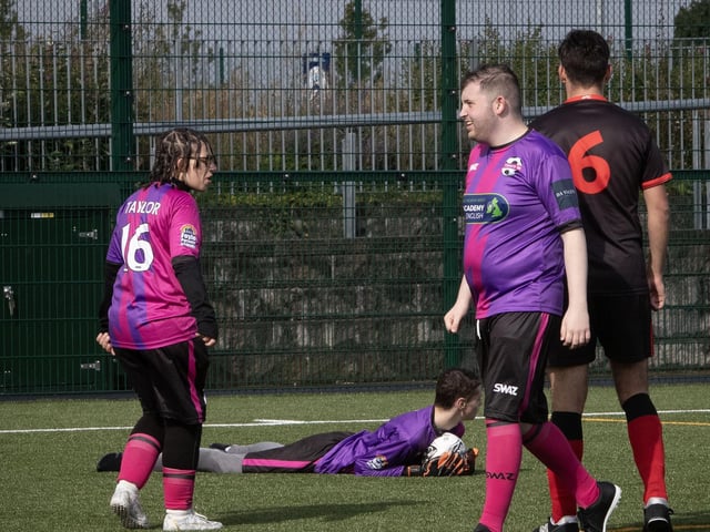 Tuned-in goalkeeper pulls of a fantastic save and takes the plaudits from the crowd.