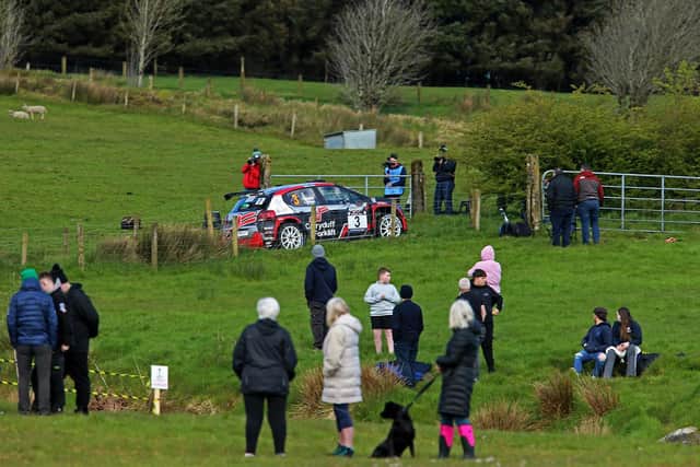 Spectators watch current McGrady Insurance Northern Ireland Rally Championship leader, Jonny Greer, pass through one of the six stages. (Photo: William Neill / www.NeillPics.com)