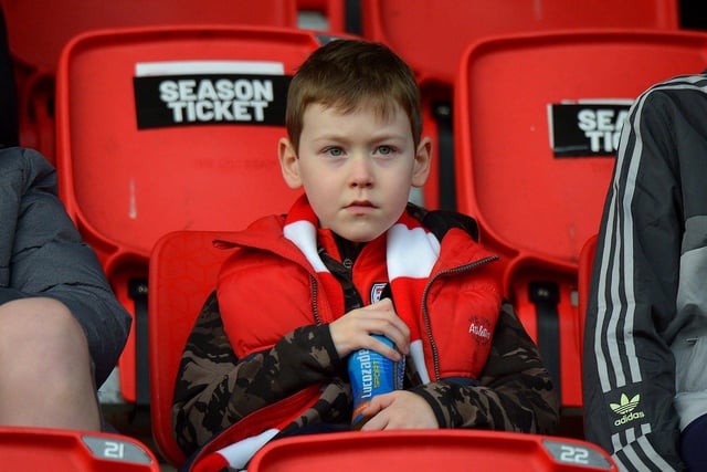 This young Derry City fan is patiently waiting for the game against Finn Harps to start. Photo: George Sweeney. DER2305GS – 08