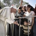 Pope Francis meets migrants at the Moria detention centre on April 16, 2016 in Mytilene, Lesbos, Greece. (Photo by Andrea Bonetti/Greek Prime Minister's Office via Getty Images)