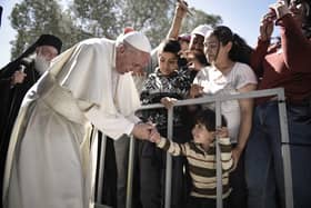 Pope Francis meets migrants at the Moria detention centre on April 16, 2016 in Mytilene, Lesbos, Greece. (Photo by Andrea Bonetti/Greek Prime Minister's Office via Getty Images)