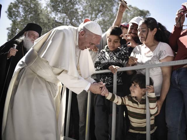 Pope Francis meets migrants at the Moria detention centre on April 16, 2016 in Mytilene, Lesbos, Greece. (Photo by Andrea Bonetti/Greek Prime Minister's Office via Getty Images)
