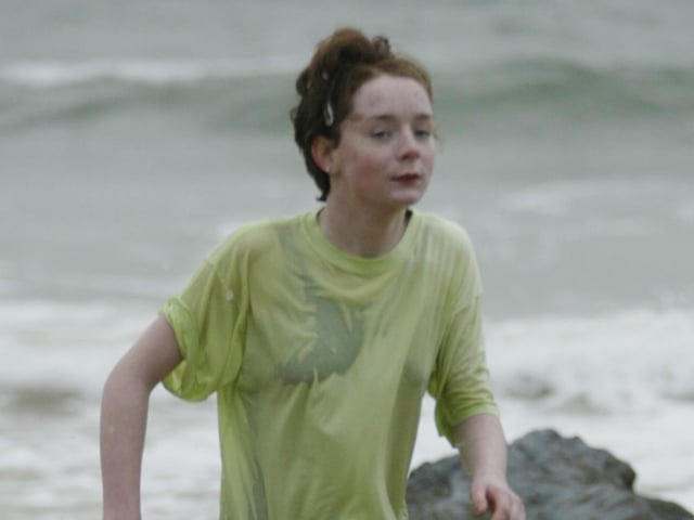 Glad thats over!!! This young girl braves the elements during the New Years Day swim at Culdaff in aid of the Carndonagh Community Hospital. (0301JB05)
